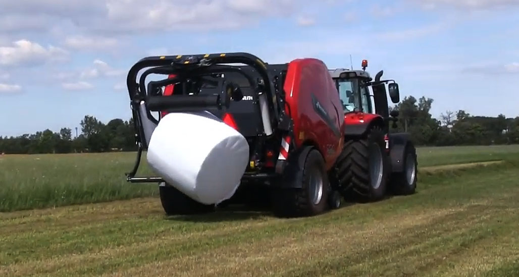 The bale is gently placed onto the ground with no rolling momentum.